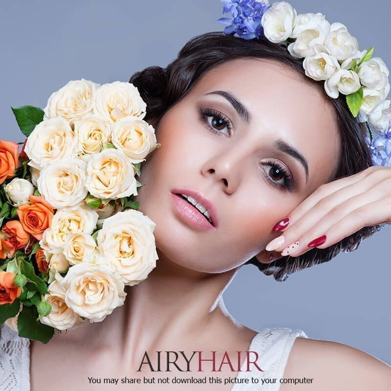 A combination of white flowers and black hair