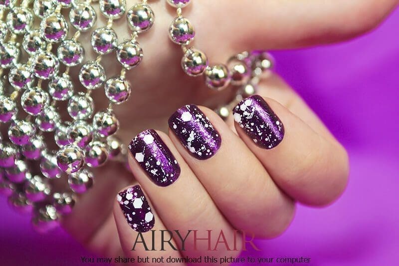 Glossy dark magenta nail design with white dots