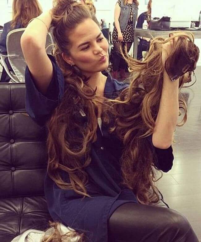 Chrissy Teigen with Hair Extensions” src= Chrissy Teigen with Hair Extensions